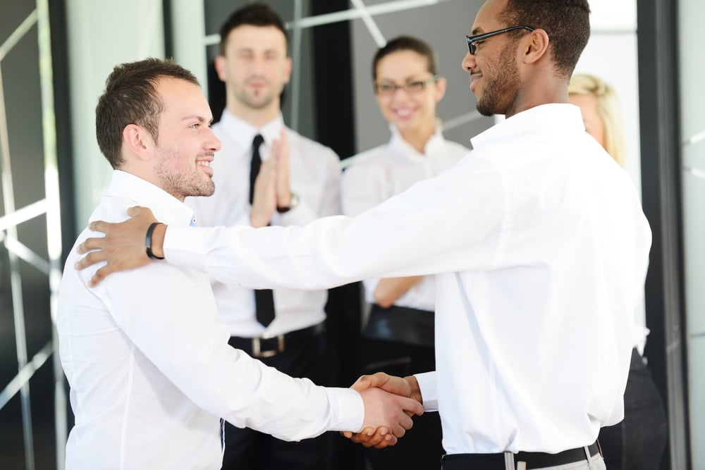 Business handshake after signing new contract-1