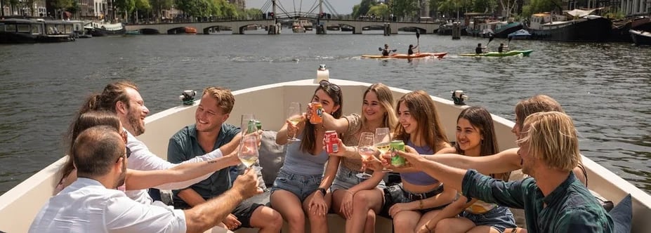 group of employees of the fun group having a toast on a boat