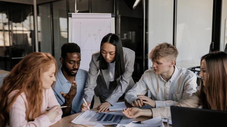Employees working together analysing the latest employee benefit trends