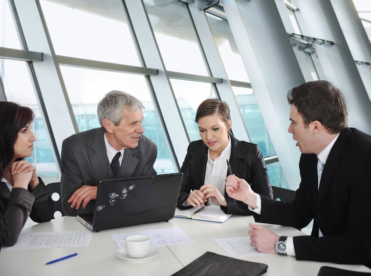 team discussing PTO accrual methods in meeting room