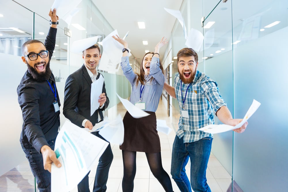 Group of joyful excited business people throwing papers and having fun in office-Dec-04-2023-09-35-17-6902-AM