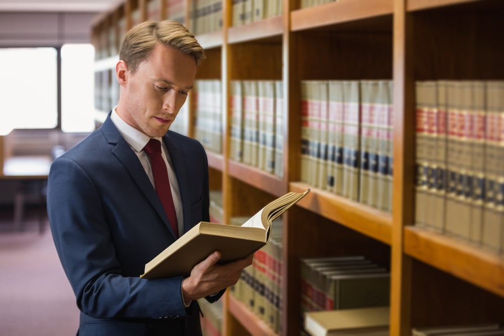 Handsome lawyer in the law library at the university-2