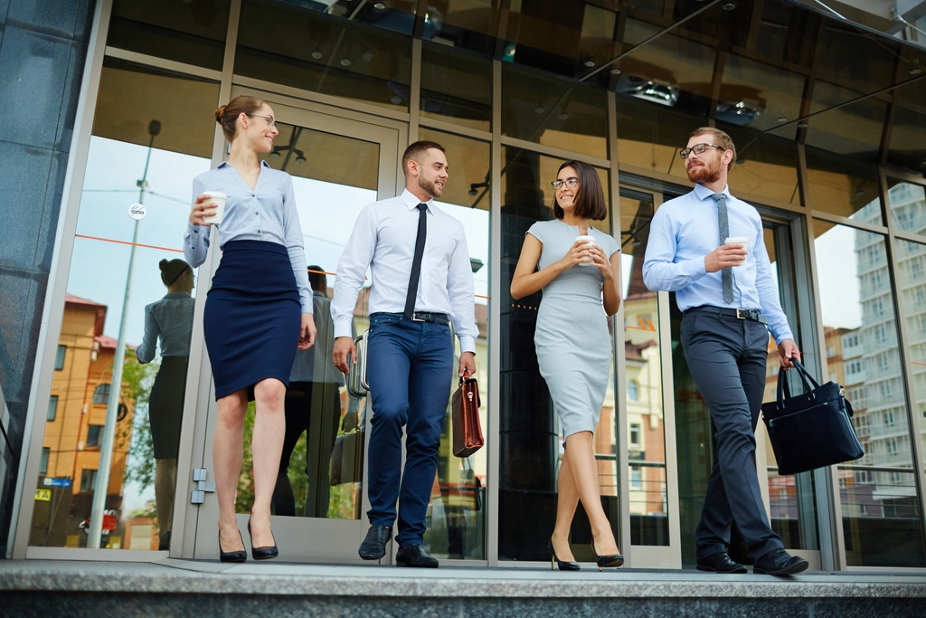 Happy employees leaving office