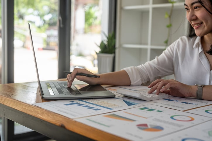 manager working on payroll reports