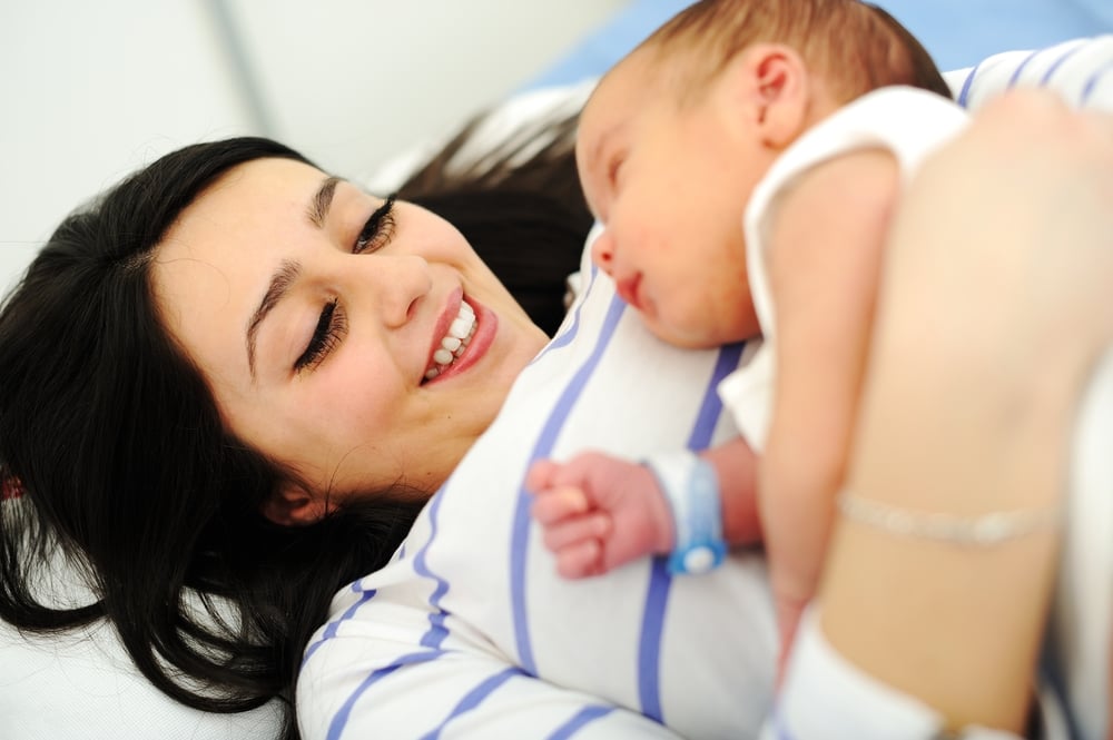 Happy mother with newborn baby