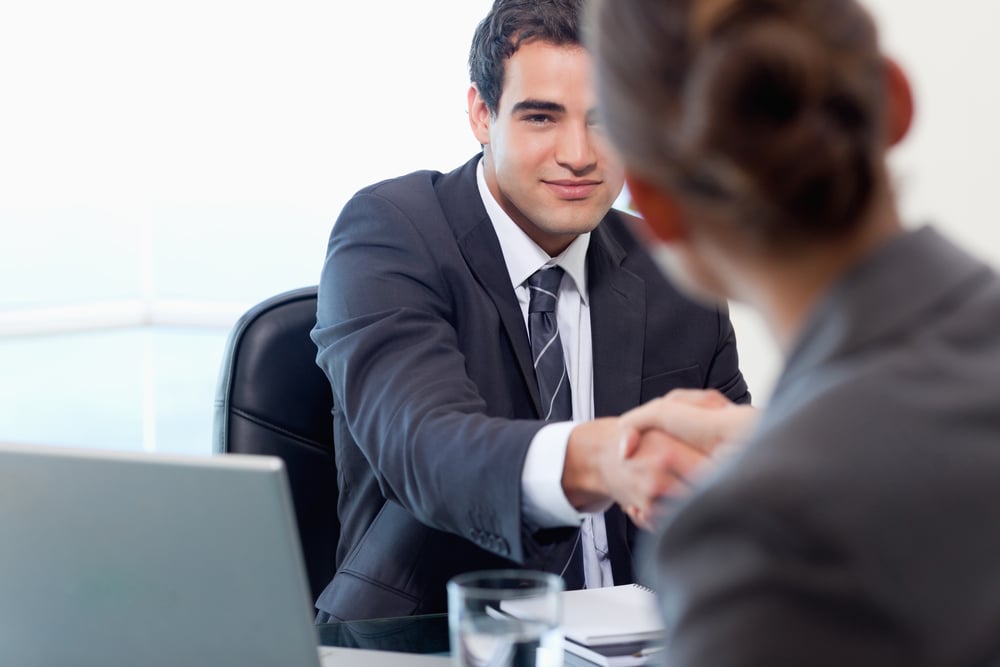 Manager interviewing a female applicant in his office