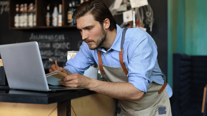 Manager looking at the types of shift work schedules he could use to schedule employees