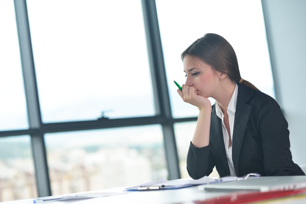 Portrait of tired young business woman at the office-1