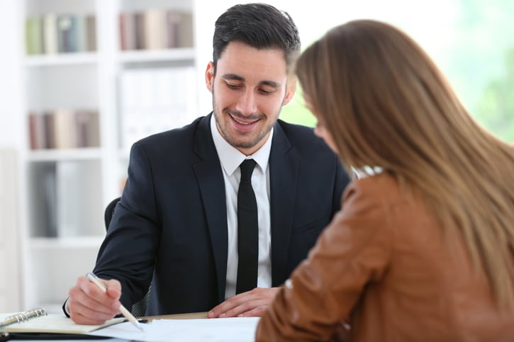 Woman an man meeting and looking at data on paper, probationary period