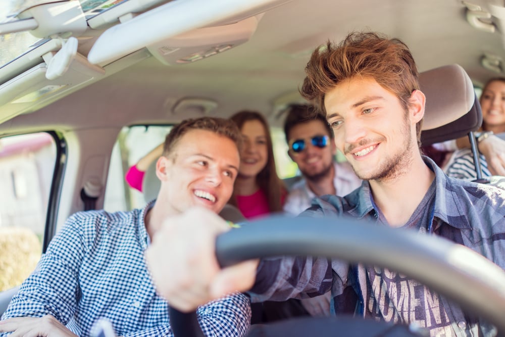 Young people having vacation enjoying fun driving car-2