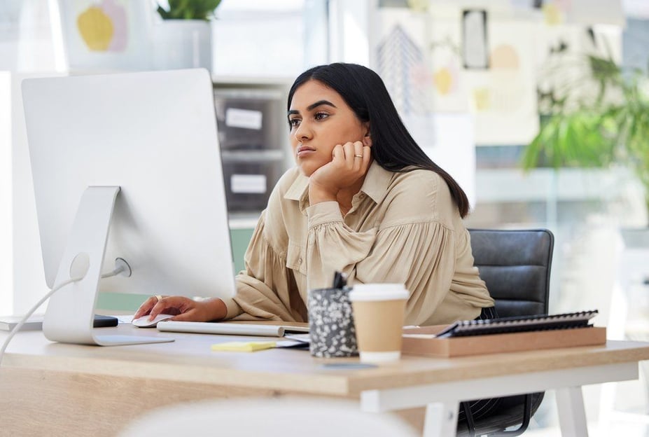 stages of burnout, a bored lazy and tired employee working on a computer at work