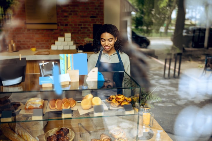 barista behind bakery counter