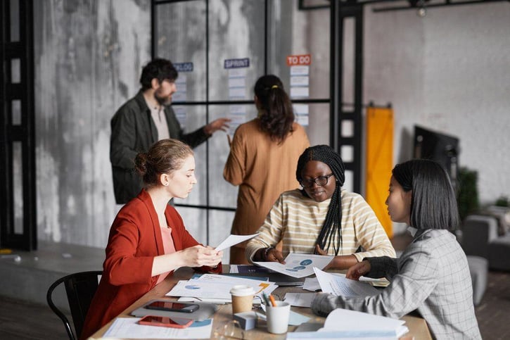 business people or full time employees working on project in modern office