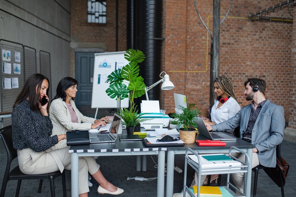 business people sitting and working at office desk