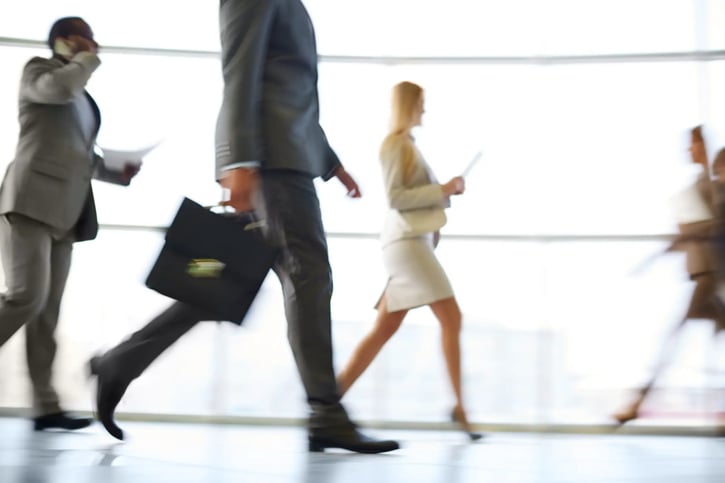 business people walking in a hurry symbolising leave travel allowance