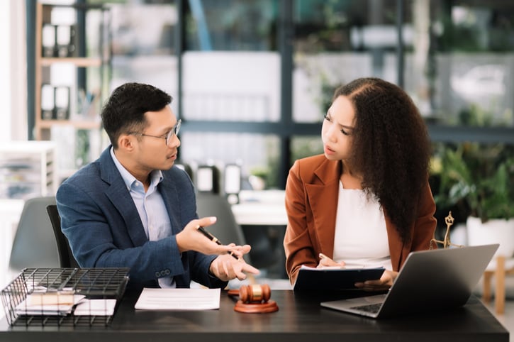 HR manager discussing unpaid time off policy with an employee.