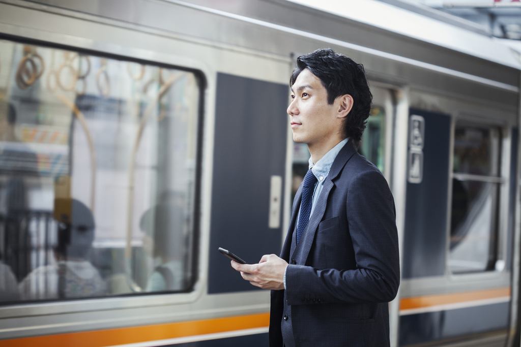 businessman-wearing-suit-standing-at-train-station-2022-03-04-02-14-25-utc_50