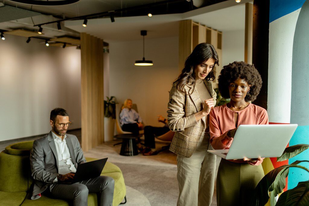 collaborative moment between employees at a modern office