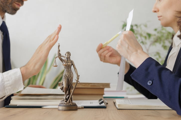 discussion of legal matters in office symbolising employment litigation