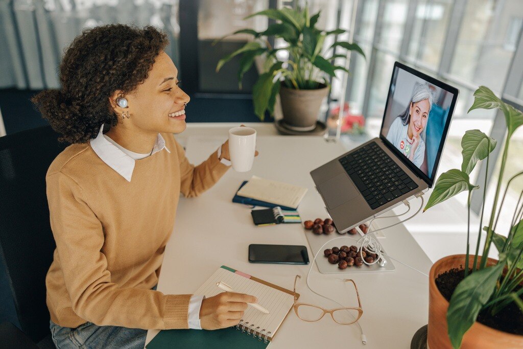 Remote employees engaging through video calls, highlighting digital employee experience in remote work.