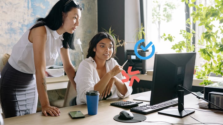 employers looking at computer screen comparing Shiftbase vs Deputy