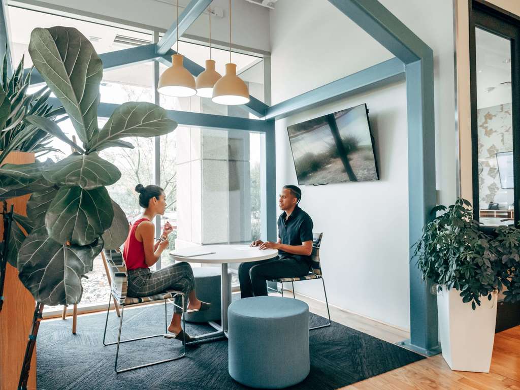 female and male colleagues in a meeting room