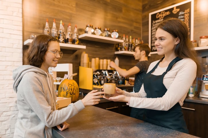 female barista working a double shift