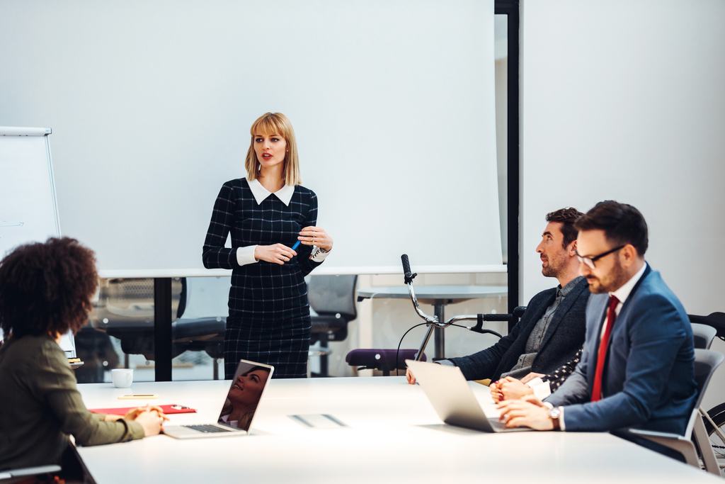 female team manager leading a business meeting