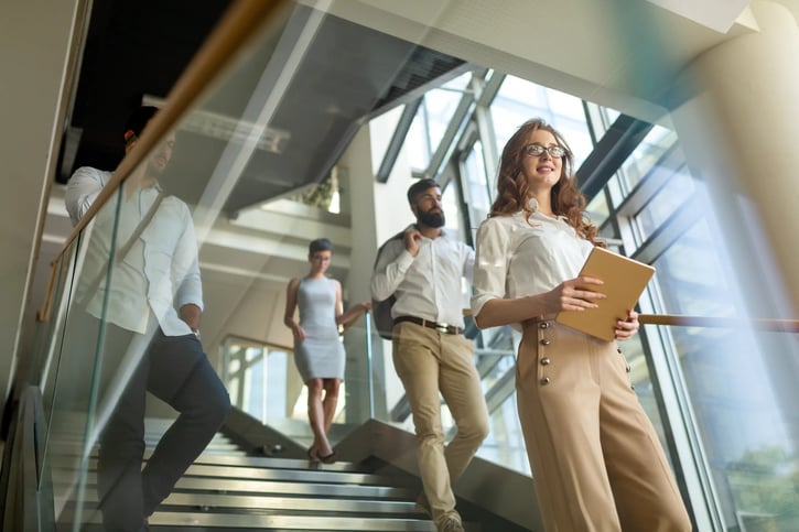group of business employees walking down the stairs symbolising their career path