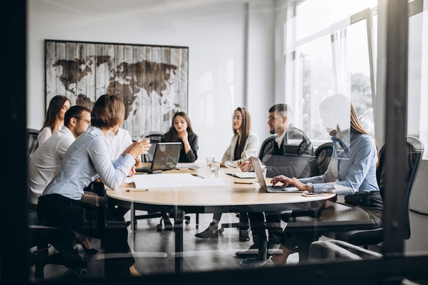 employee team in meeting room symbolising team communication