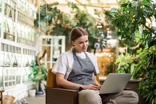 manager working on absence management on laptop