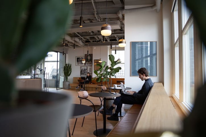 manager working on his laptop in cafe restaurant