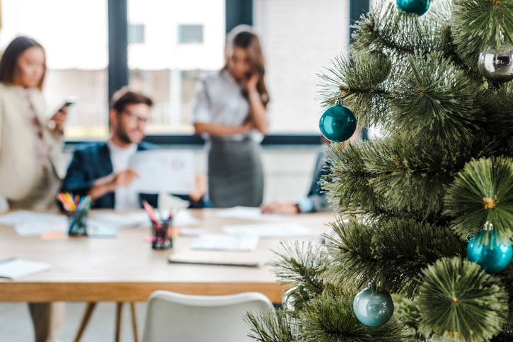 selective focus of decorated Christmas tree in the workplace