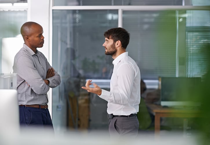 serious dialogue at work between employee and manager