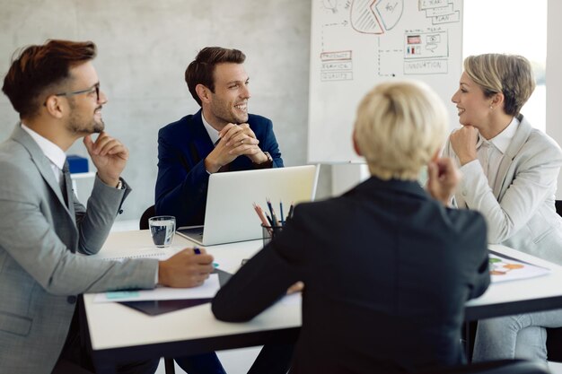 smiling team of executive having a business meeting at the table