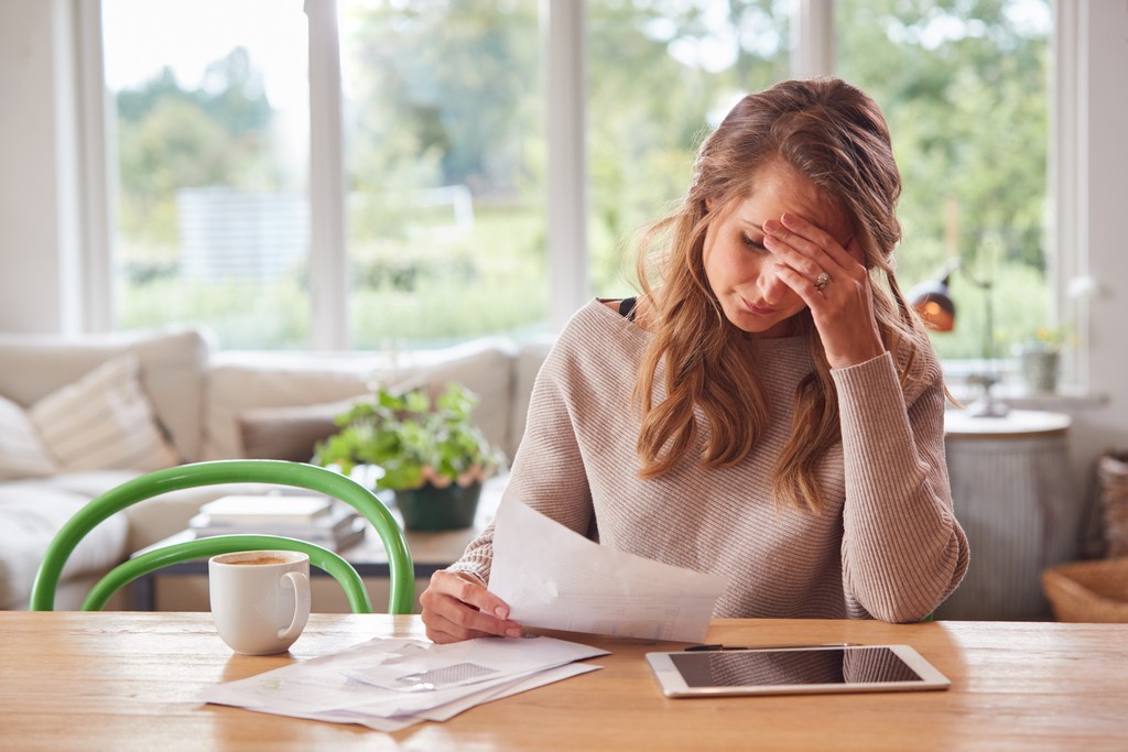 worried-woman-with-digital-tablet-sitting-at-table-2021-08-30-19-59-21-utc_50