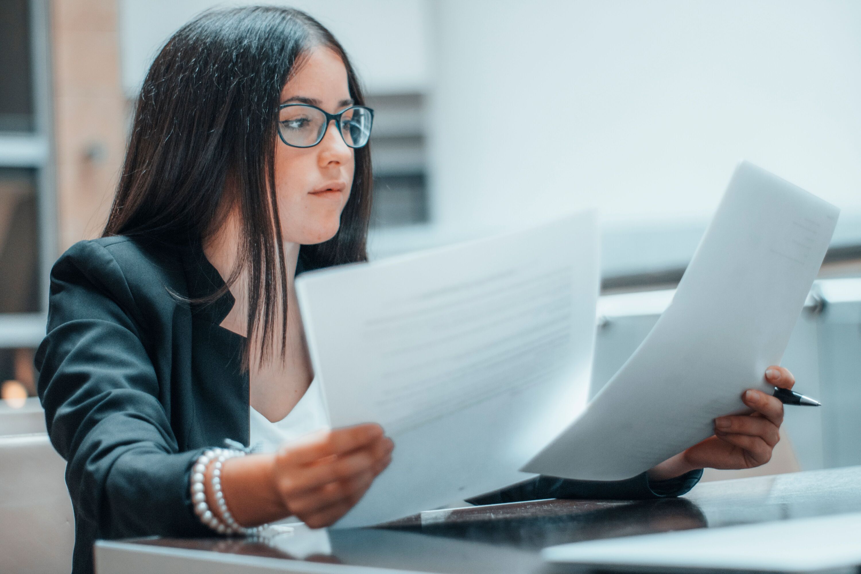 young-businesswoman-in-glasses-and-a-suit-working-2023-11-27-04-56-00-utc_50