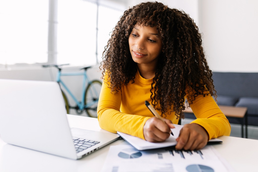 young-businesswoman-working-on-laptop-from-home-of-2022-12-09-04-34-45-utc_50 (1)