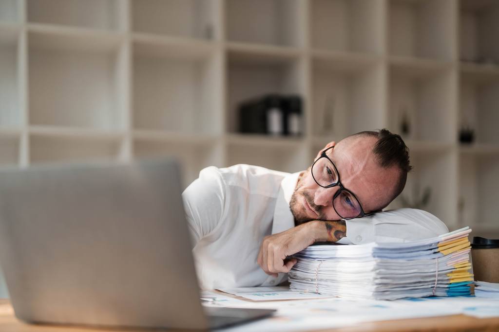 young-unhappy-man-office-worker-feeling-bored-at-w-2023-03-07-04-08-08-utc_50